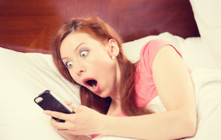 Oversleeping. Attractive young woman missed the ringing of the alarm clock and have overslept awakening and are late, reacting in horror at the time. Funny face expression, emotion, feeling, reaction