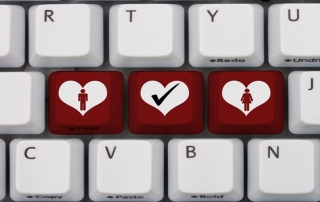Online Dating, A gray computer keyboard with man and man symbol with a heart in red letters